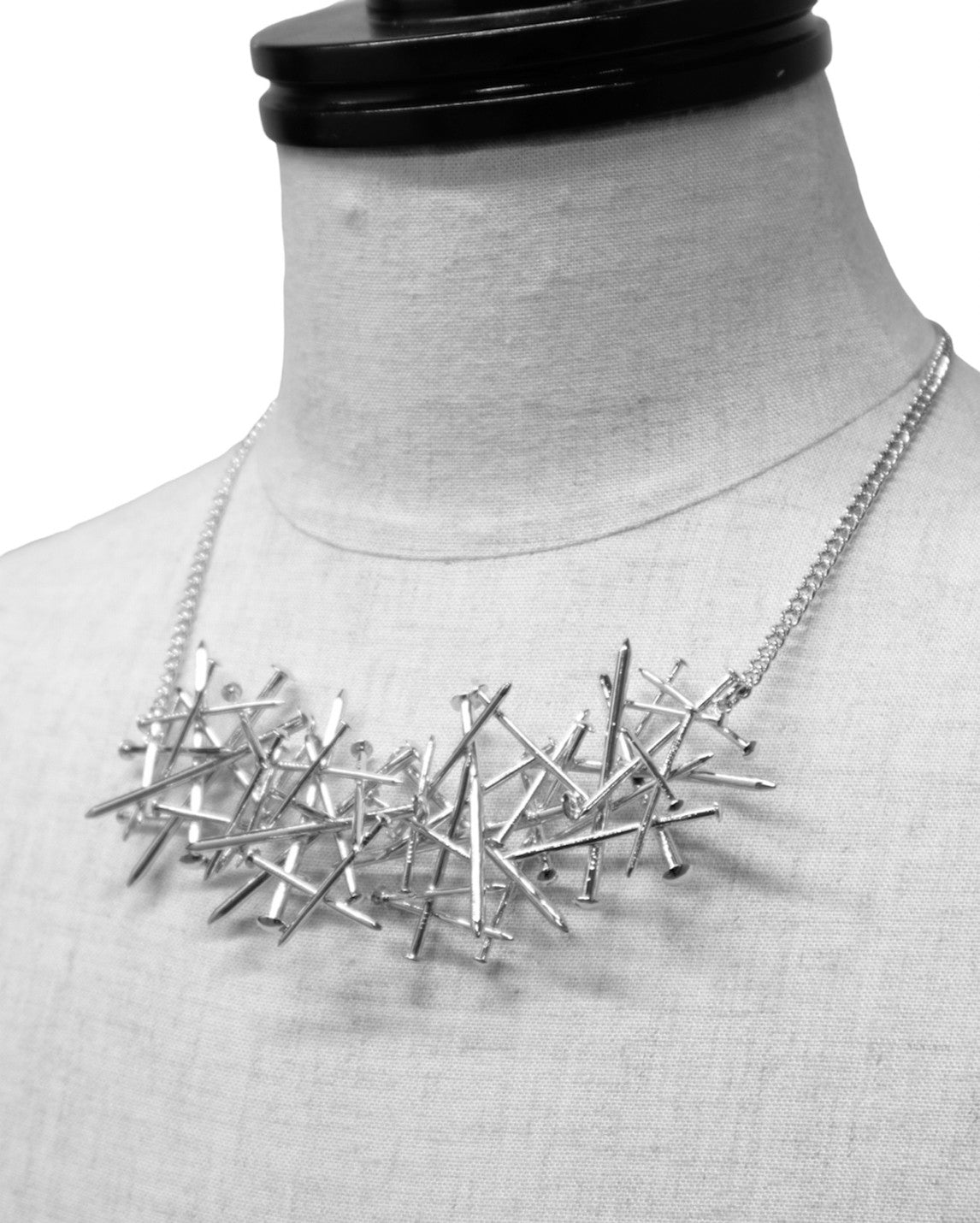 Intricate nail necklace